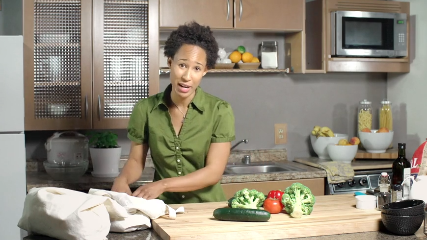 Opening frame: a mother in her kitchen, produce on the cutting board
