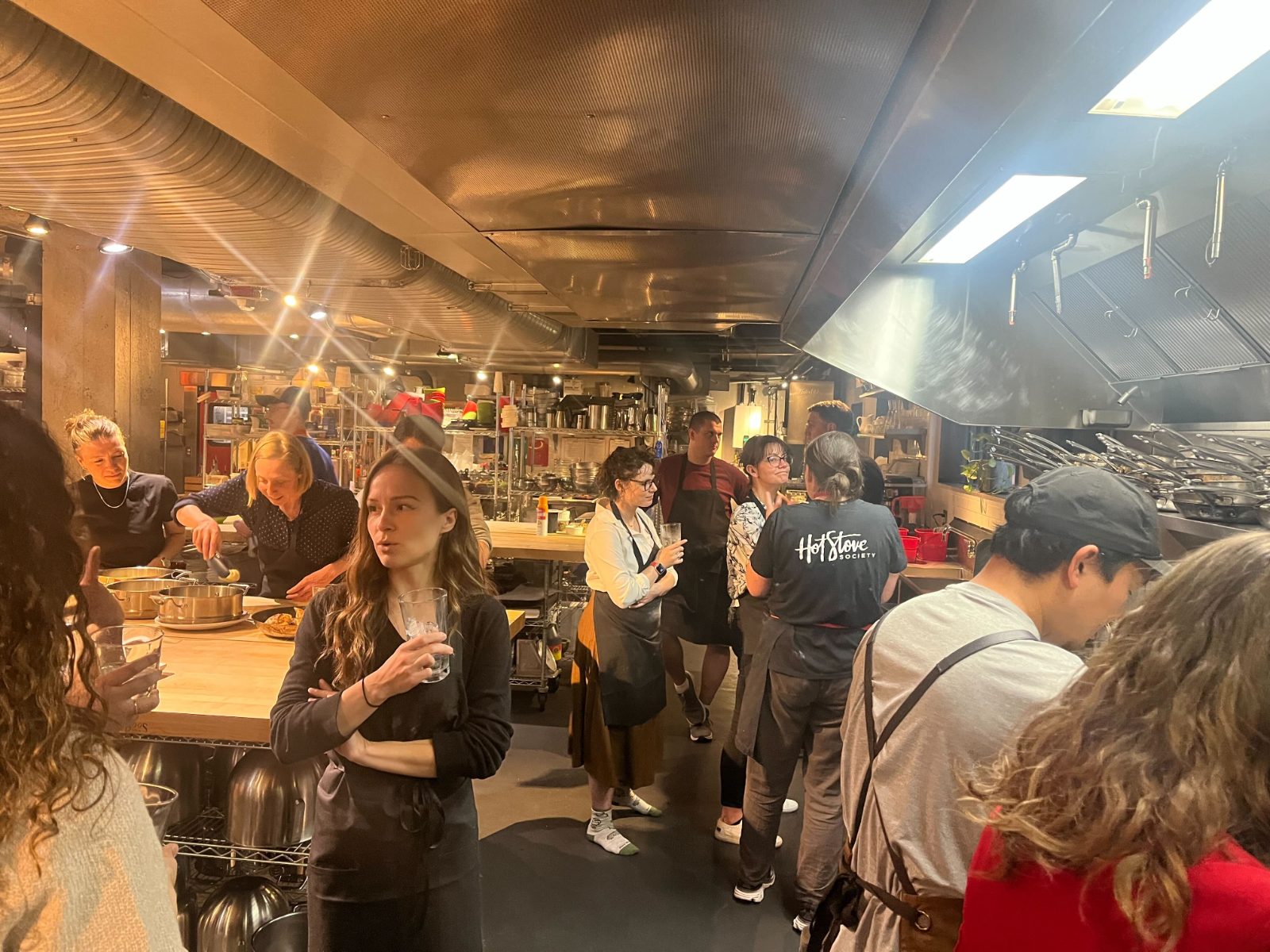 A studio cooking class in a professional kitchen