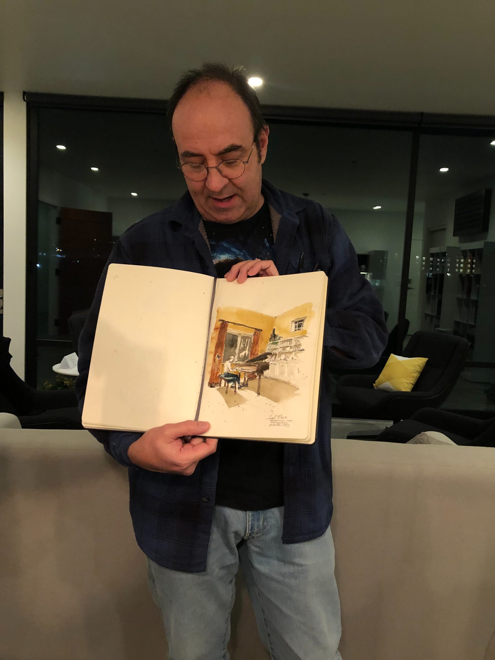 A colleague sharing a sketchbook with the studio