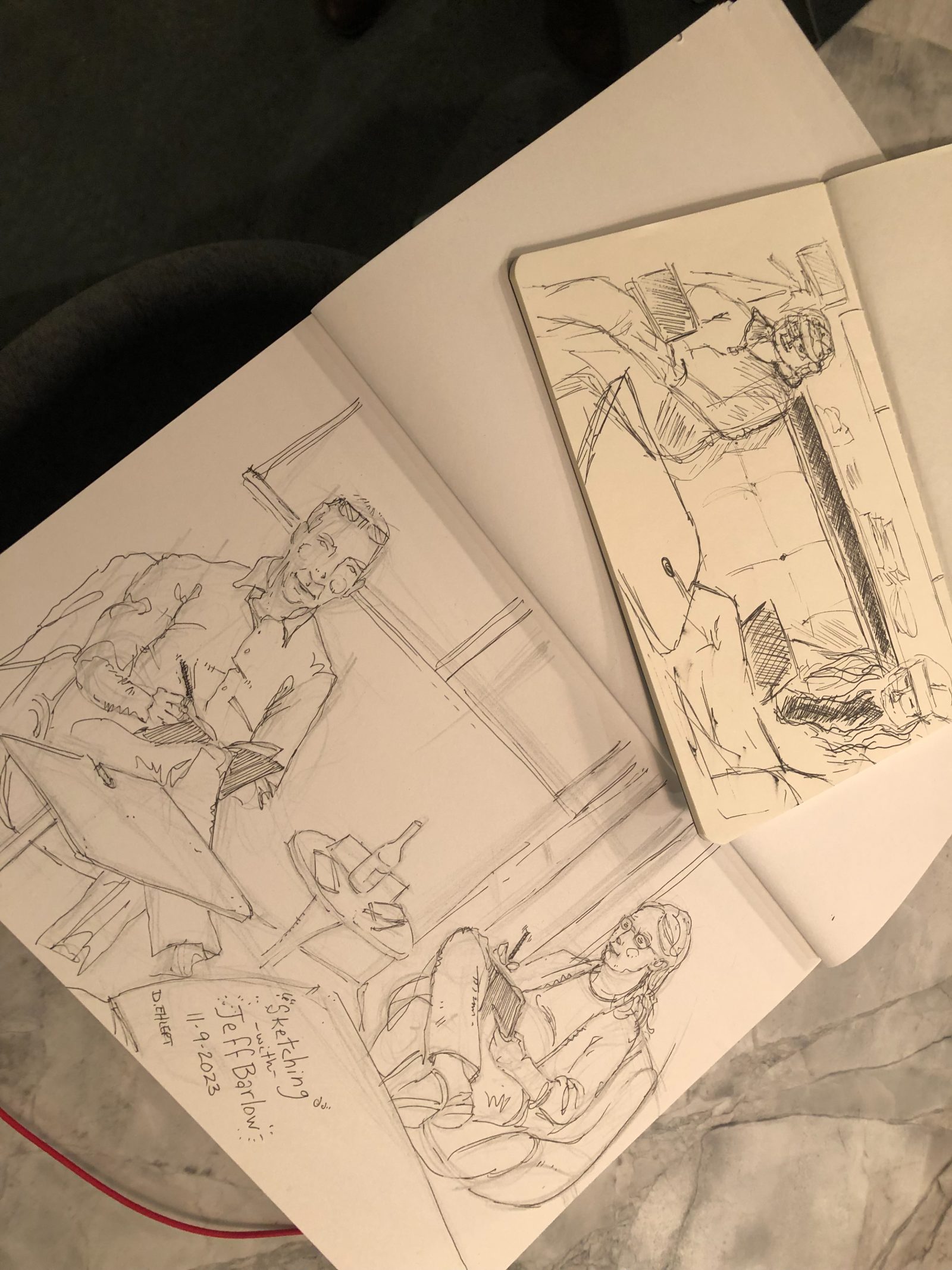An open sketchbook spread of drawings